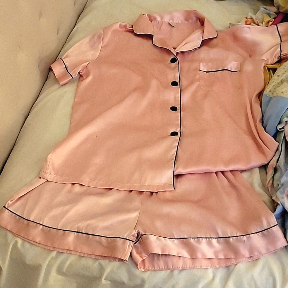Very feminine pink with black trim silky pajama short set.  Size medium